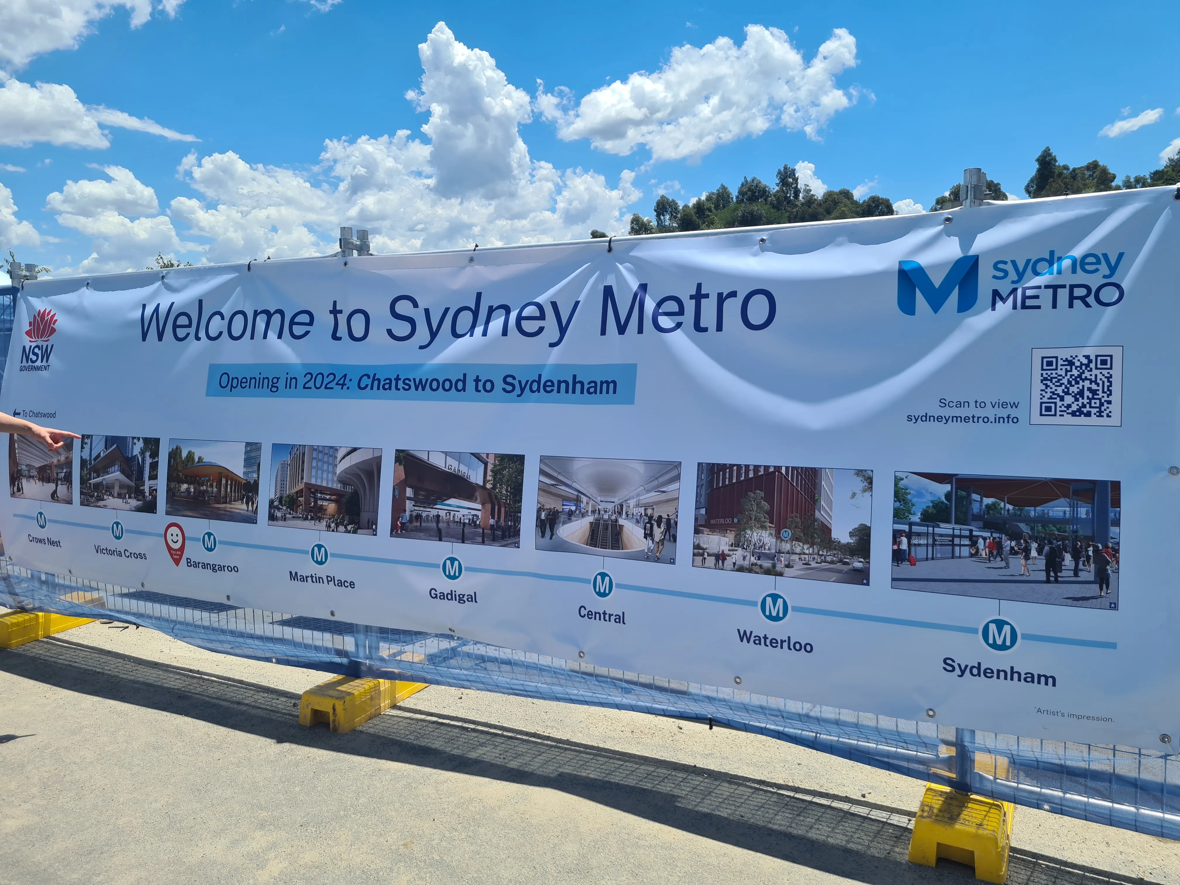 A Welcome banner placed in front of the station entrance, with the under-construction route of the
Metro extension from Chatswood to Sydenham.